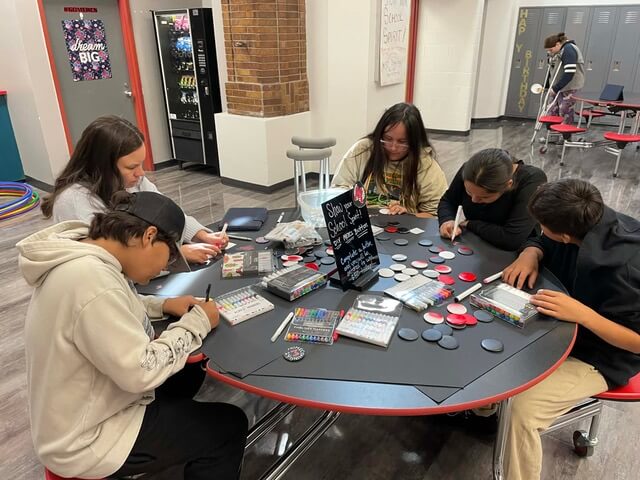 a group of kids working on community projects